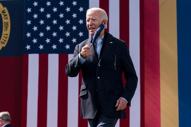 Democratic presidential candidate former Vice President Joe Biden arrives to speak during a campaign event at Riverside High School in Durham, N.C., Sunday, Oct. 18, 2020. (AP Photo/Carolyn Kaster)