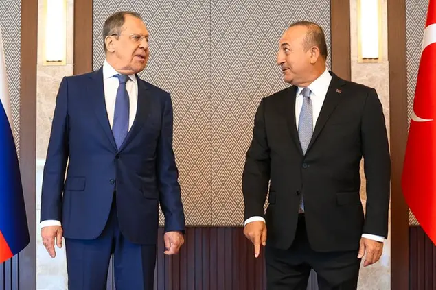 In this photo released by the Russian Foreign Ministry Press Service, Russia's Foreign Minister Sergey Lavrov, left, and his Turkish counterpart Mevlut Cavusoglu speak during their meeting in Ankara, Turkey, Wednesday, June 8, 2022. (Russian Foreign Ministry Press Service via AP)