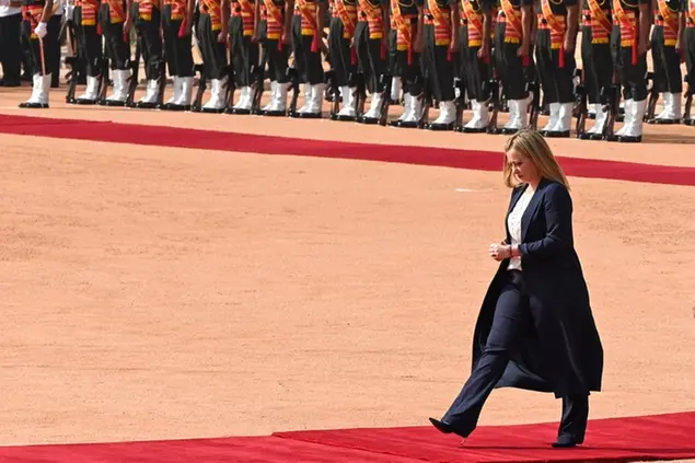 Italian Premier Giorgia Meloni returns after inspecting a guard of honor during a ceremonial reception at the Indian Presidential Palace in New Delhi, India, Thursday, March 2, 2023. (AP Photo) Associated Press/LaPresse Only Italy and Spain