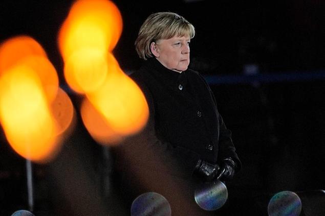 02 December 2021, Berlin: Chancellor Angela Merkel (CDU) stands on the podium during her farewell by the Bundeswehr. Chancellor Merkel bid farewell with a Grand Taps ceremony at the Bendlerblock towards the end of her term in office after 16 years. She invited a good 50 federal ministers from her time in office to the event, along with a number of companions from various sectors of society. Photo by: Michael Kappeler/picture-alliance/dpa/AP Images