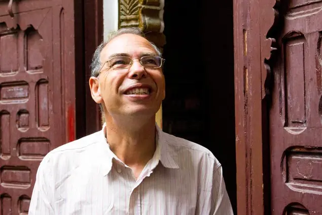 FILE - This Sept. 17, 2015 file picture shows Moroccan historian and journalist Maati Monjib standing outside the local headquarters of a human rights group in Rabat, Morocco. Moroccan prosecutors have announced the arrest of the prominent academic on suspicion of money laundering. (AP Photo/Paul Schemm, File)