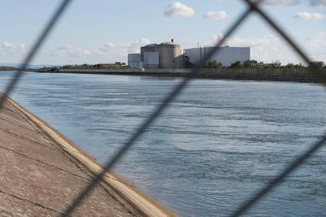 The nuclear power plant of Fessenheim, eastern France, is pictured from its security fence Monday June 29, 2020. Nuclear workers lamented the switching off Monday of France\\\\'s oldest nuclear reactor, a closure celebrated by anti-nuclear campaigners. The last of two 900-megawatt reactors at Fessenheim was being powered down and taken off line overnight, part of a policy shift to reduce France\\\\'s world-leading dependence on nuclear power. (AP Photo/Jean-Francois Badias)