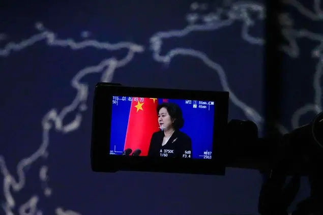 A camera monitor shows Chinese Foreign Ministry spokeswoman Hua Chunying speaking against a map showing the United States of America and China during a daily briefing at the Ministry of Foreign Affairs office in Beijing, Wednesday, Aug. 3, 2022. After weeks of threatening rhetoric, China showed the spirit but stopped short of any direct military confrontation with the U.S. over the visit to Taiwan of a senior American politician, House Speaker Nancy Pelosi. (AP Photo/Andy Wong)