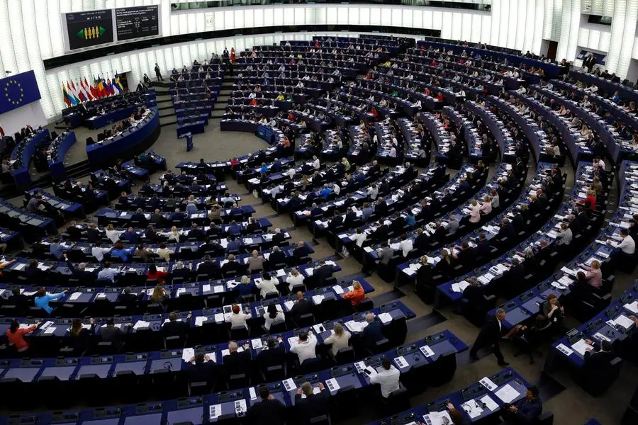 Members of the parliament vote on plans to reduce carbon emissions, at the European Parliament, Wednesday, June 8, 2022 in Strasbourg, eastern France. The future of car transport in Europe may become clearer — and cleaner —on Wednesday when the European Parliament decides whether to ban vehicles with a combustion engine starting in the middle of the next decade. (AP Photo/Jean-Francois Badias)
