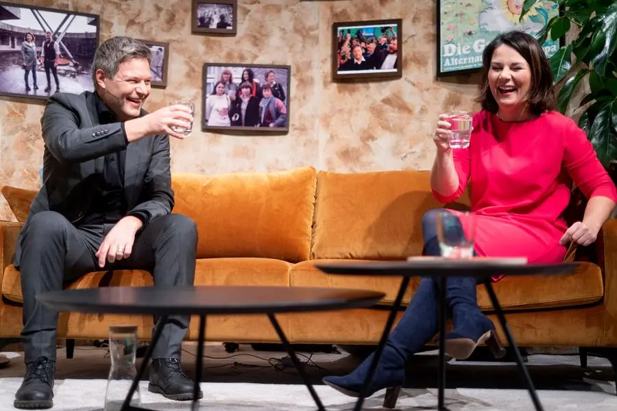 dpatop - 21 November 2020, Berlin: Robert Habeck, Federal Chairperson of B'ndnis 90/Die Gr'nen, and Annalena Baerbock, Federal Chairperson of B'ndnis 90/Die Gr'nen, talk in the so-called living room at the digital federal party conference of the Greens after the Chairperson's speech. In the year of their 40th anniversary, the Greens want to adopt a new basic program. The party conference will take place as a large video conference. Only the executive committee and the presidium will be in the broadcasting center, the Tempodrom. Photo by: Kay Nietfeld/picture-alliance/dpa/AP Images
