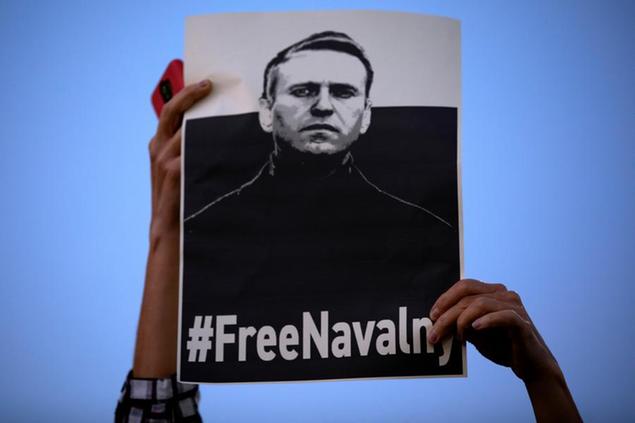 A women holds a \\\"Free Navalny\\\" sign during a protest against Russia's jailing of opposition leader Alexei Navalny, in Tel Aviv, Israel, Wednesday, April. 21, 2021. About 200 people, mostly Russians who immigrated to Israel, participated in the protest and called for Navalny's release. (AP Photo/Oded Balilty)