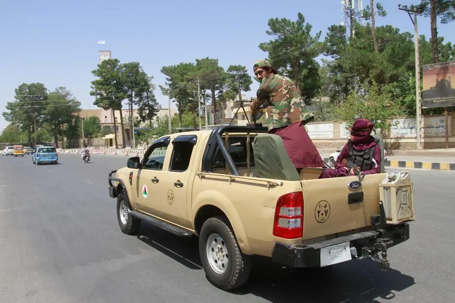 Taliban fighters sit on the back of a vehicle in the city of Herat, west of Kabul, Afghanistan, Saturday, Aug. 14, 2021, after they took this province from Afghan government. The Taliban seized two more provinces and approached the outskirts of Afghanistan’s capital. (AP Photo/Hamed Sarfarazi) Taliban fighters sit on the back of a vehicle in the city of Herat, west of Kabul, Afghanistan, Saturday, Aug. 14, 2021, after they took this province from Afghan government. The Taliban seized two more provinces and approached the outskirts of Afghanistan’s capital. (AP Photo/Hamed Sarfarazi) Talleban seen in the city of Herat after they take this province from Afghan Government-in Herat province, west of Kabul Afghanistan, Saturday, Aug.14.2021.( AP Photo/ Hamed Sarfarazi