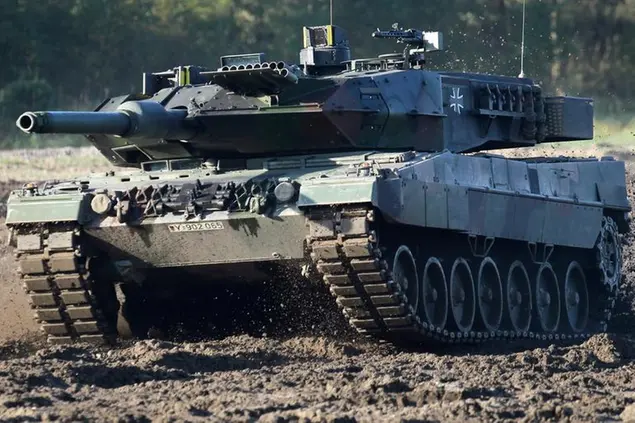 FILE - A Leopard 2 tank is pictured during a demonstration event held for the media by the German Bundeswehr in Munster near Hannover, Germany, Wednesday, Sept. 28, 2011. Germany faces mounting pressure to supply battle tanks to Kyiv and Ukrainian President Volodymyr Zelenskyy is airing frustration about not obtaining enough weaponry as Western allies confer on how best to support Ukraine nearly 11 months into Russia’s invasion. Germany’s new defense minister welcomed U.S. Defense Secretary Lloyd Austin to Berlin, declaring that German weapons systems delivered so far have proven their worth and that aid will continue in the future. (AP Photo/Michael Sohn, File)