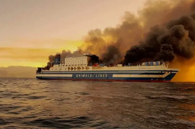A ferry is on fire at the Ionian Sea near the island of Corfu, Greece, on Friday, Feb. 18, 2022. More than 280 people have been evacuated from the ferry in northwestern Greece that caught fire overnight, while heading to southern Italy, authorities said. (Lazos Madikos/debater.gr. via AP)