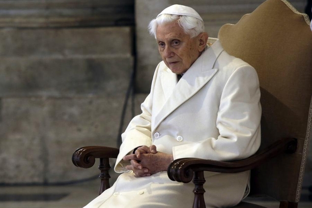 FILE - This Dec. 8, 2015 file photo shows Pope Emeritus Benedict XVI sitting in St. Peter's Basilica as he attends the ceremony marking the start of the Holy Year. Retired Pope Benedict XVI asked forgiveness Tuesday, Feb. 8, 2022, for any \\u00E2\\u20AC\\u0153grievous faults\\\" in his handling of clergy sex abuse cases, but admitted to no personal or specific wrongdoing after an independent report criticized his actions in four cases while he was archbishop of Munich, Germany. (AP Photo/Gregorio Borgia)
