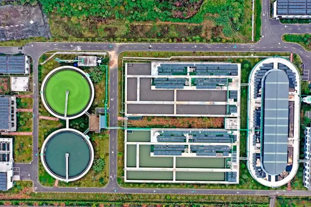 Aerial photo shows rows of photovoltaic modules generating clean energy on the roof of an enterprise in Xianju County, Taizhou City, east China's Zhejiang Province, 8 December, 2022. (Imaginechina via AP Images)
