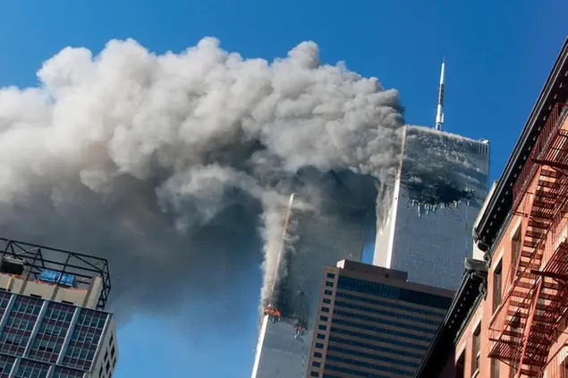 FILE - Smoke rises from the burning twin towers of the World Trade Center after hijacked planes crashed into the towers, Sept. 11, 2001, in New York. (AP Photo/Richard Drew, File)