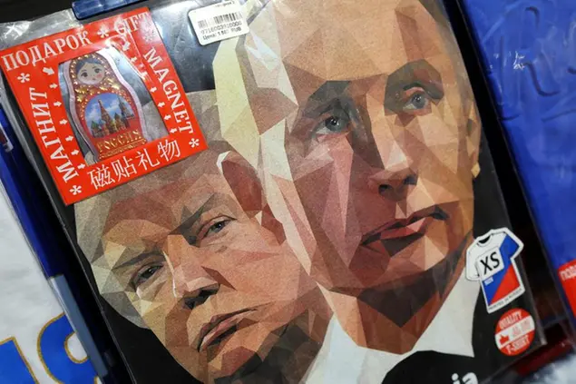 epa12298133 A t-shirt featuring portraits of Russian President Putin (R) and US President Trump (L) is on display for sale at a souvenir market in Moscow, Russia, 13 August 2025. A meeting in Alaska, USA of Putin and Trump is scheduled for 15 August 2025. EPA/MAXIM SHIPENKOV