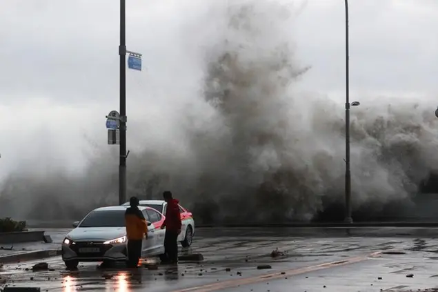 Waves crash over the breakwater in Busan, South Korea, Tuesday, Sept. 6, 2022. Thousands of people were forced to evacuate in South Korea as Typhoon Hinnamnor made landfall in the country's southern regions on Tuesday, unleashing fierce rains and winds that destroyed trees and roads, and left more than 20,000 homes without power. (Sohn Hyung-joo/Yonhap via AP)
