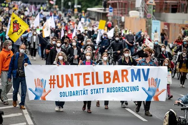 04 September 2021, Berlin: Participants walk through Berlin-Mitte on the demonstration of the Alliance Indivisible with the motto \\\"For an open and solidary society\\\". The signatories of the call include more than 160 organizations, associations and initiatives. Photo by: Fabian Sommer/picture-alliance/dpa/AP Images