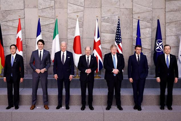 From left, Japan's Prime Minister Fumio Kishida, Canada's Prime Minister Justin Trudeau, U.S. President Joe Biden, Germany's Chancellor Olaf Scholz, British Prime Minister Boris Johnson, France's President Emmanuel Macron, Italy's Prime Minister Mario Draghi pose for a G7 leaders' group photo during a NATO summit in Brussels, Thursday March 24, 2022. (Henry Nicholls/Pool via AP)