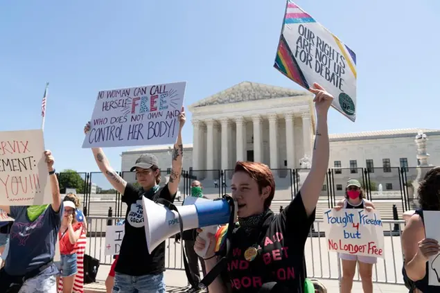 Abortion-rights activists protest outside the Supreme Court in Washington, Monday, July 4, 2022. The Supreme Court has ended constitutional protections for abortion that had been in place nearly 50 years, a decision by its conservative majority to overturn the court's landmark abortion cases. (AP Photo/Jose Luis Magana)