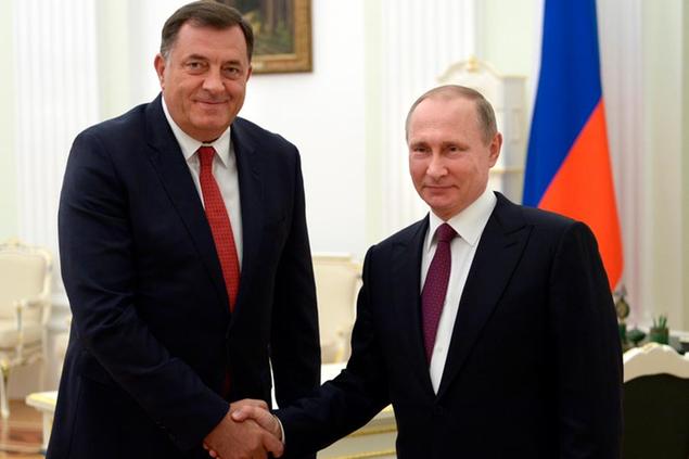 FILE - In this Thursday, Sept. 22, 2016 file photo, Russian President Vladimir Putin, right, shakes hands with President of the Republic of Srpska Milorad Dodik in Moscow's Kremlin, Russia. Just days before a crucial vote, Bosnian Serb leader Milorad Dodik traveled to Russia to a Formula One race, not because he\\u00E2\\u20AC\\u2122s a fan but for another meeting with Russian President Vladimir Putin. While the Russian influence is the most obvious in the Balkans, an upsurge of populism in Central Europe has also played into Moscow\\u00E2\\u20AC\\u2122s hands, providing sympathetic political parties and politicians across the continent, including in European Union nations Hungary, Austria and the Czech Republic. (Alexei Nikolsky/Sputnik, Kremlin Pool Photo via AP, file)