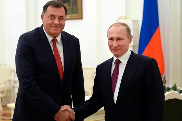 FILE - In this Thursday, Sept. 22, 2016 file photo, Russian President Vladimir Putin, right, shakes hands with President of the Republic of Srpska Milorad Dodik in Moscow's Kremlin, Russia. Just days before a crucial vote, Bosnian Serb leader Milorad Dodik traveled to Russia to a Formula One race, not because heâ€™s a fan but for another meeting with Russian President Vladimir Putin. While the Russian influence is the most obvious in the Balkans, an upsurge of populism in Central Europe has also played into Moscowâ€™s hands, providing sympathetic political parties and politicians across the continent, including in European Union nations Hungary, Austria and the Czech Republic. (Alexei Nikolsky/Sputnik, Kremlin Pool Photo via AP, file)