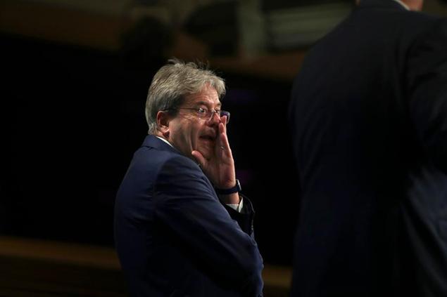 European Commissioner for Economy Paolo Gentiloni prepares to address a media conference on the Tax Package at EU headquarters in Brussels, Wednesday, July 15, 2020. (AP Photo/Francisco Seco, Pool)