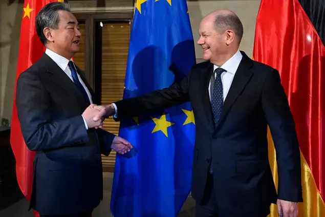 17 February 2023, Bavaria, Munich: Wang Yi (l), Director of the Office of the Central Commission for Foreign Affairs of the Central Committee of the Communist Party of China, and German Chancellor Olaf Scholz (SPD) meet for bilateral talks and shake hands at the Munich Security Conference. The 59th Munich Security Conference (MSC) will be held at the Bayerischer Hof Hotel in Munich from February 17 to 19, 2023. Photo by: Thomas Kienzle/picture-alliance/dpa/AP Images