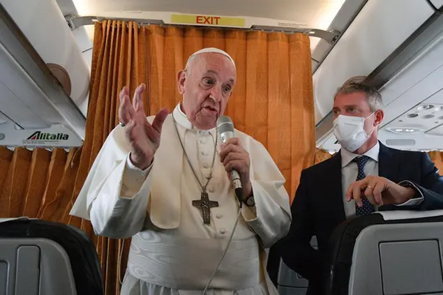 Pope Francis speaks with journalists on board an Alitalia aircraft enroute from Bratislava back to Rome, Wednesday, Sept. 15, 2021 after a four-day pilgrimage to Hungary and Slovakia. (Tiziana Fabi, Pool via AP)