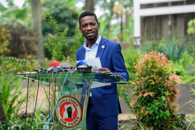 The National Unity platform presidential candidate Bobi Wine addresses the media at his home in Magere, Uganda, Friday, Jan. 15, 2021. Uganda\\u2019s electoral commission says President Yoweri Museveni leads in Thursday\\u2019s election with results in from 29% of polling stations. He has 63% of ballots while top opposition candidate Bobi Wine has 28%. Wine, a popular singer-turned-lawmaker half the president\\u2019s age, alleges that the vote in the East African country was rigged. (AP Photo/Nicholas Bamulanzeki)