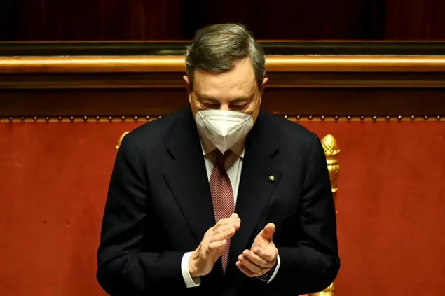 Italy's Prime Minister Mario Draghi applauds following the speech of the Senate speaker, prior to himself addressing the Senate the Senate in Rome Wednesday, Feb. 17, 2021, before submitting his government to a vote of confidence. (Alberto Pizzoli/POOL photo via AP)