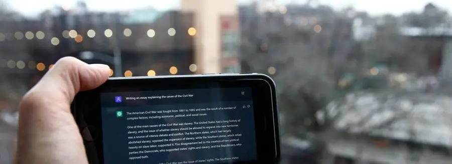 A ChatGPT prompt is shown on a device near a public school in Brooklyn, New York, Thursday, Jan. 5, 2023. New York City school officials started blocking this week the impressive but controversial writing tool that can generate paragraphs of human-like text. (AP Photo/Peter Morgan)