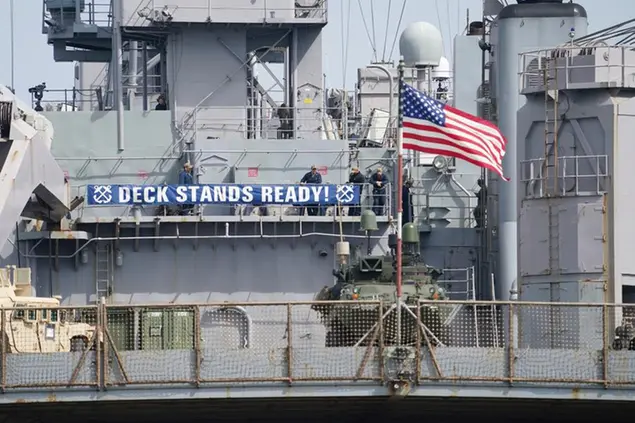 \\\"Deck Stands Ready!\\\" reads a banner on the superstructure of the U.S. dock landing ship \\\"USS Gunston Hall\\\" anchored at the naval base following the Baltic Operations (BALTOPS) maneuver, File, Germany, Friday, June 17, 2022. Since June 5, 45 ships and boats, 75 aircraft and some 7,000 troops from 14 NATO countries as well as Finland and Sweden have participated in the exercise on the Baltic Sea, according to the Navy. The U.S. Navy-led maneuver has been held annually since 1972, and this year marks the 51st time. (Marcus Brandt/dpa via AP)