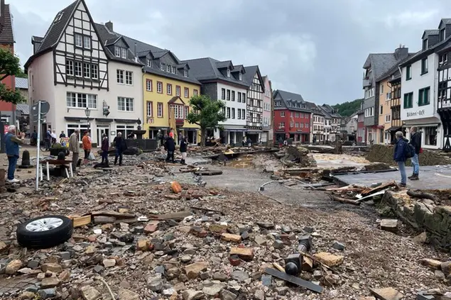 A street is covered with stones in Bad Muenstereifel, Germany, Thursday, July 15, 2021 after heavy rainfall and the flooding of the Erft river. People have died and dozens of people are missing in Germany after heavy flooding turned streams and streets into raging torrents, sweeping away cars and causing some buildings to collapse. (B&S/dpa via AP)