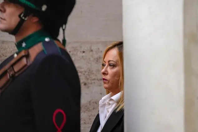 New Italian Premier Giorgia Meloni arrives for the handover ceremony at Chigi Palace Premier's office, in Rome, Sunday, Oct. 23, 2022. Giorgia Meloni, 45, whose political party with neo-fascist roots secured the most votes in Italy's national election last month, took office Sunday as the country's first far-right premier since the end of World War II. She is also the first woman to serve as premier. (AP Photo/Alessandra Tarantino)